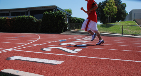 A SAC student running on the track 