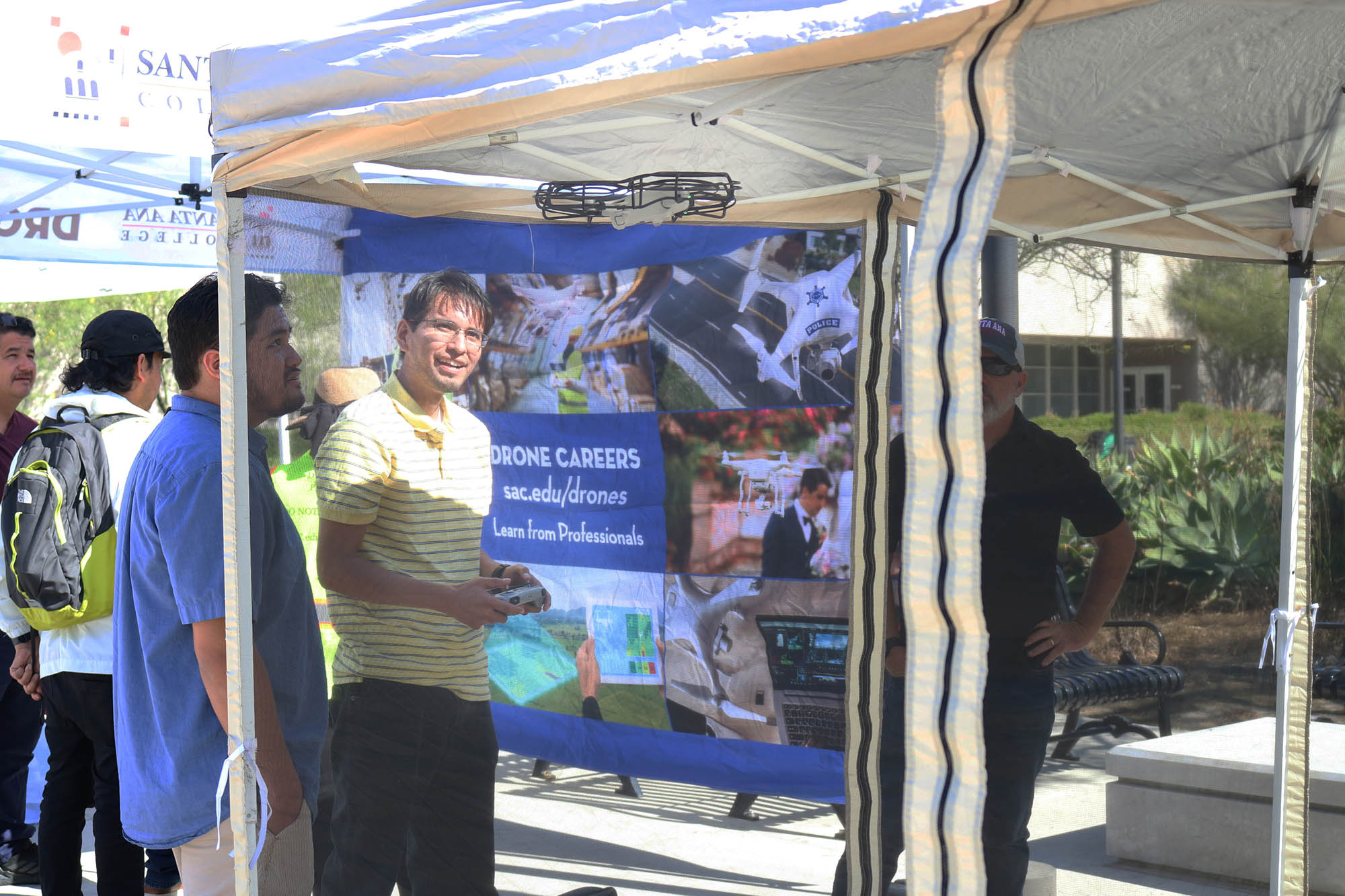 students check out Drone booth on campus