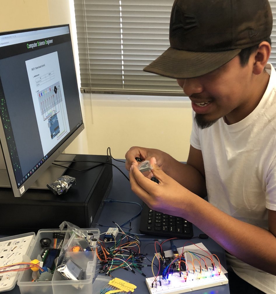student working with robotics kit