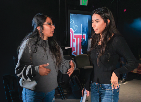 Cecilia Lorenzo working with classmate on set