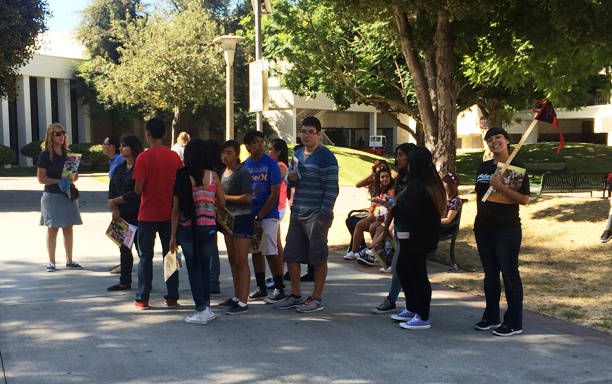 Student Ambassador Giving a tour to a group of middle school students on campus