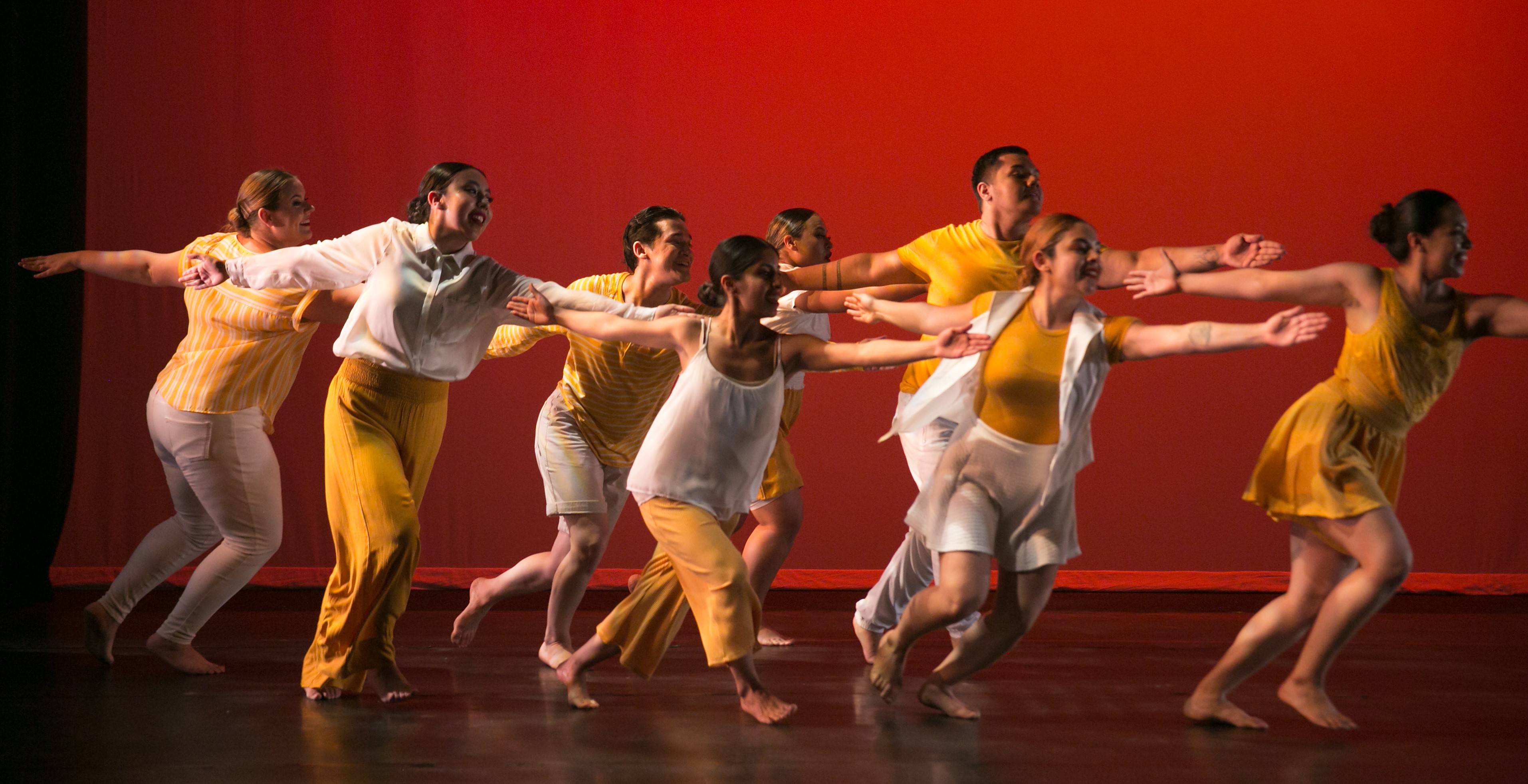 Hive dancers performing a reach movement