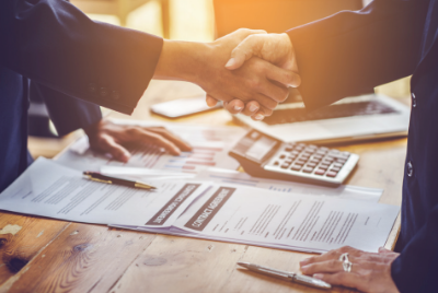 Students in classroom studying accounting on laptops