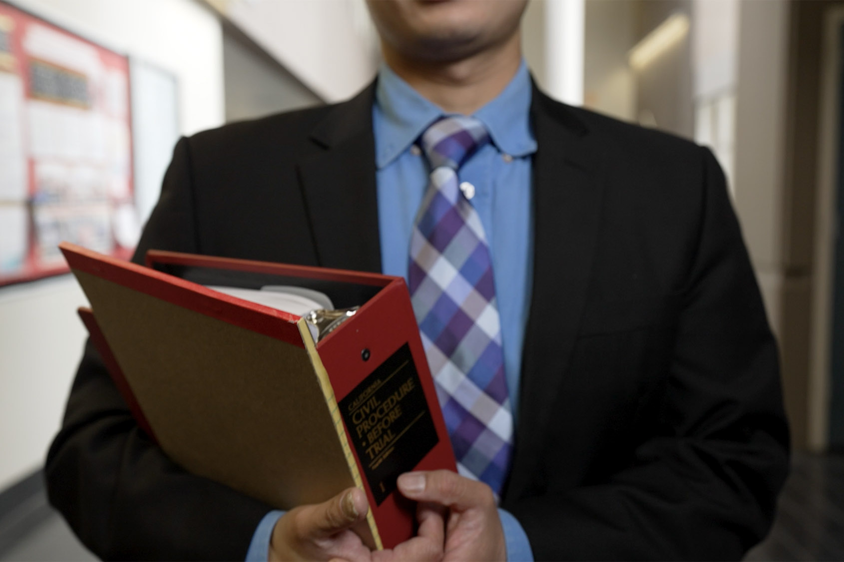 student holding binder
