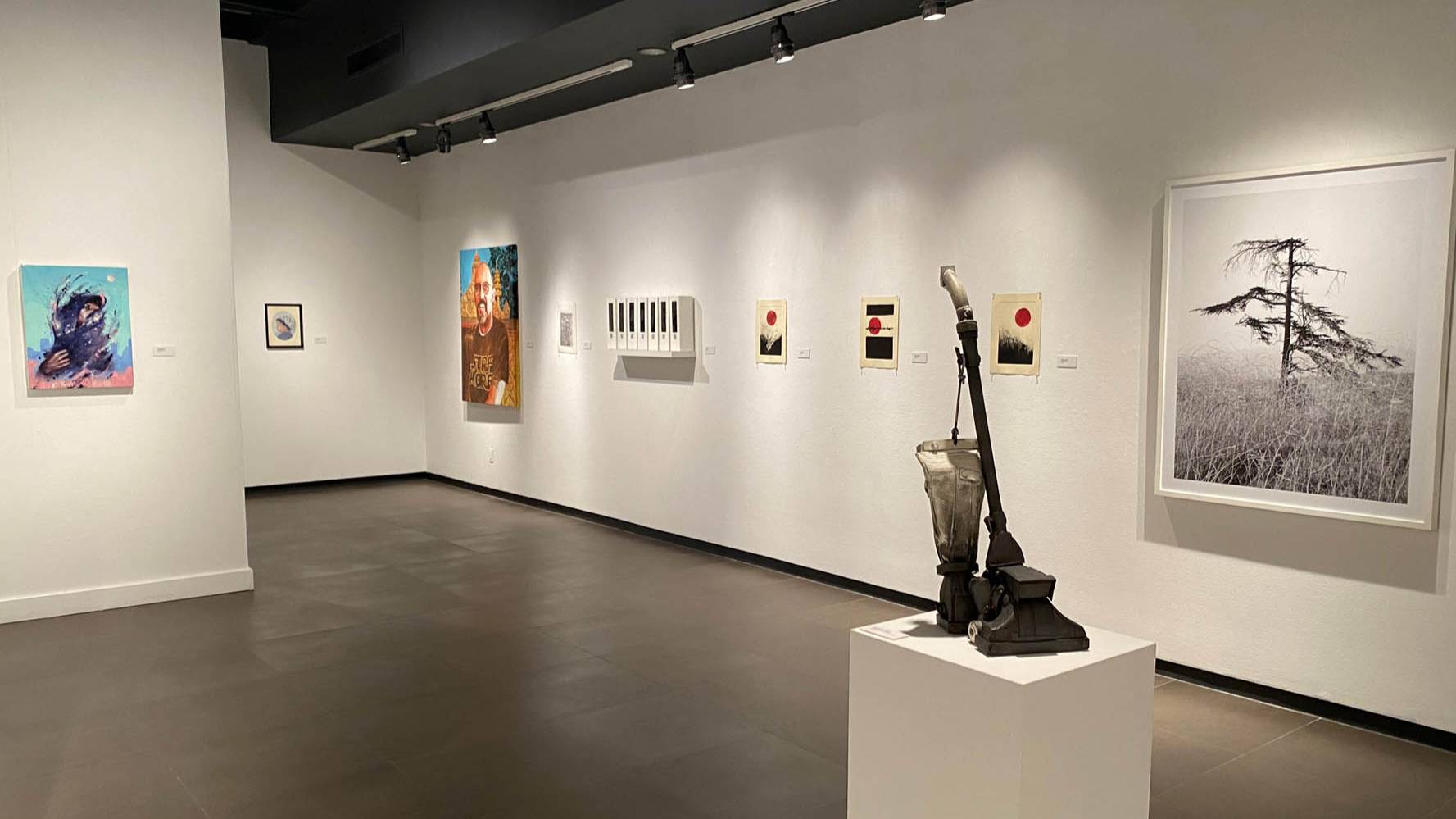 sculpture and paintings on wall