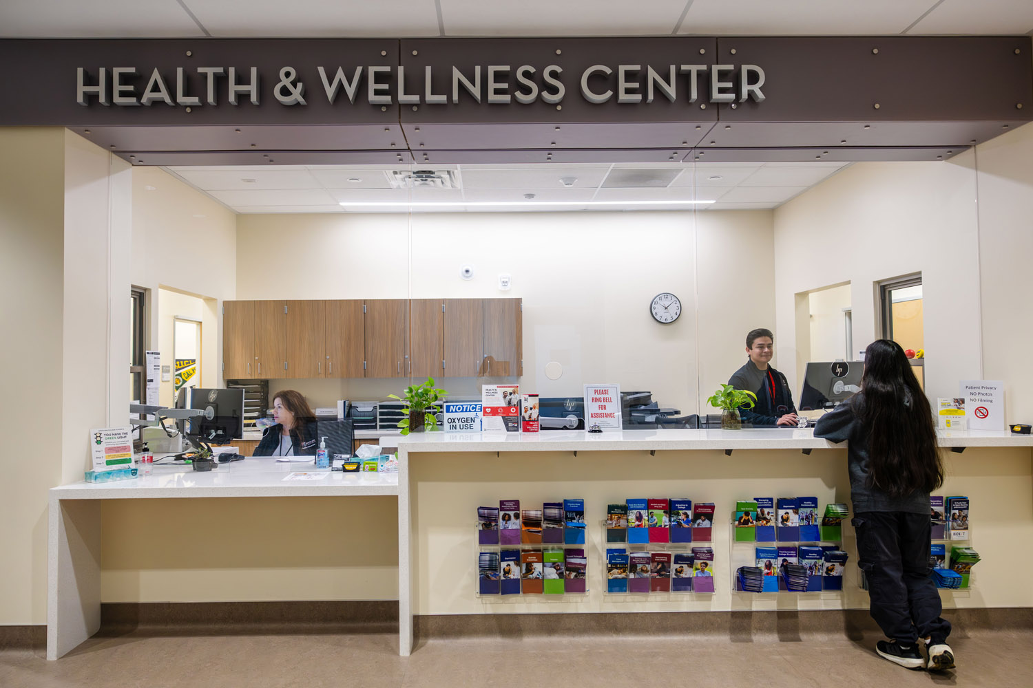student at Health & wellness check-in desk
