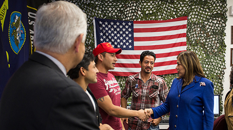 Man shaking hands with city government official