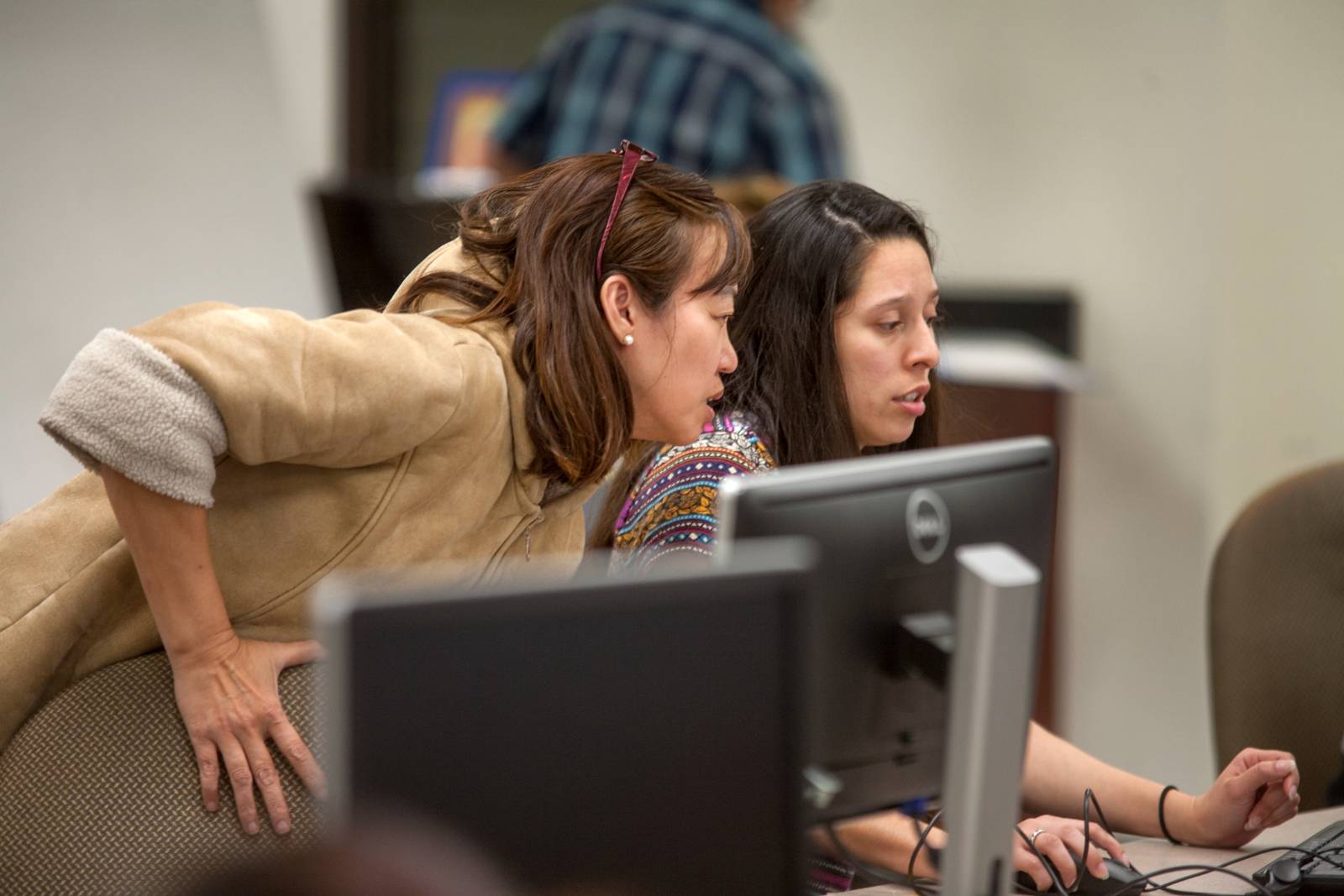 Staff helping student register