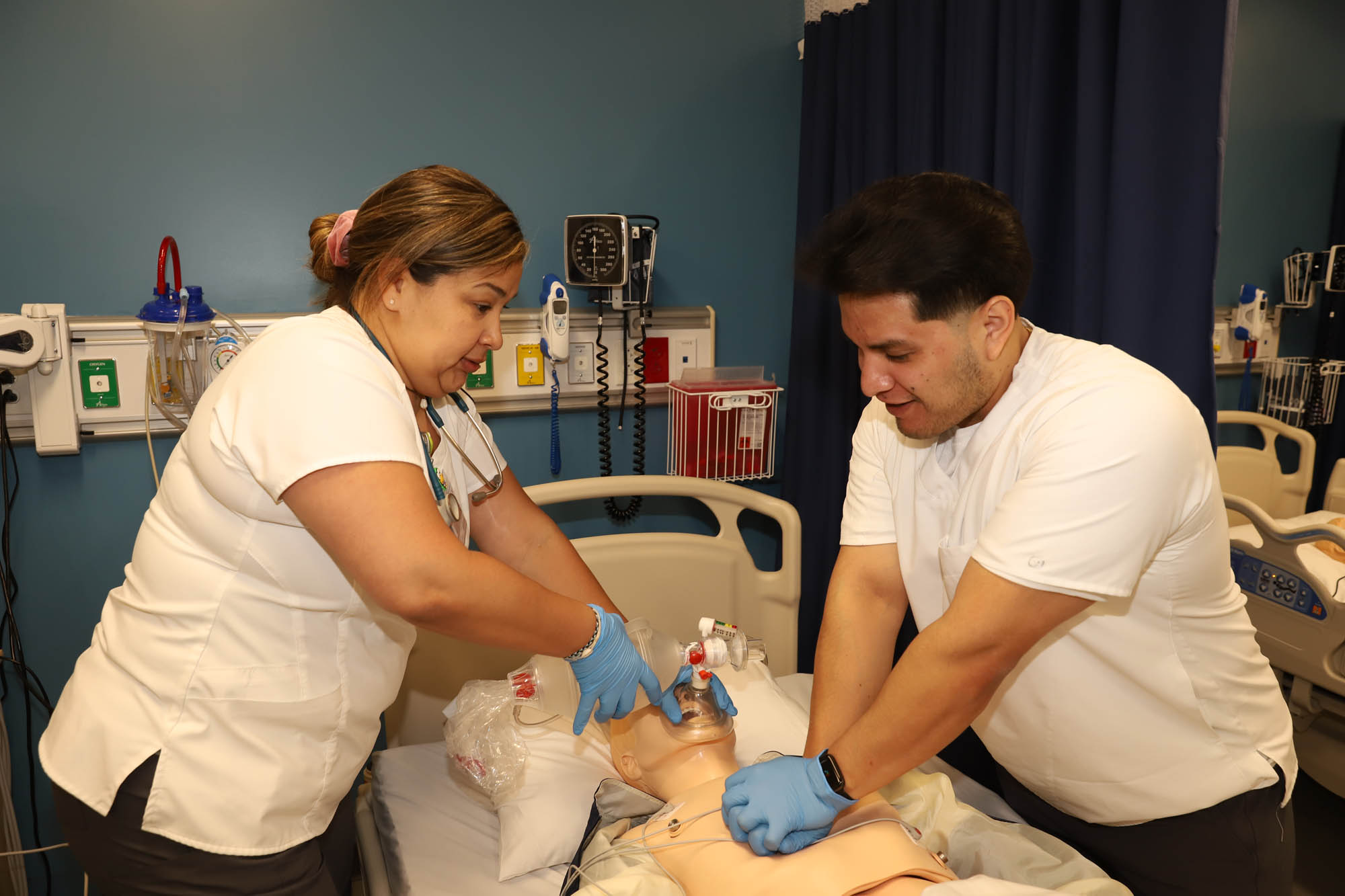 Two nursing students practicing resuscitation 