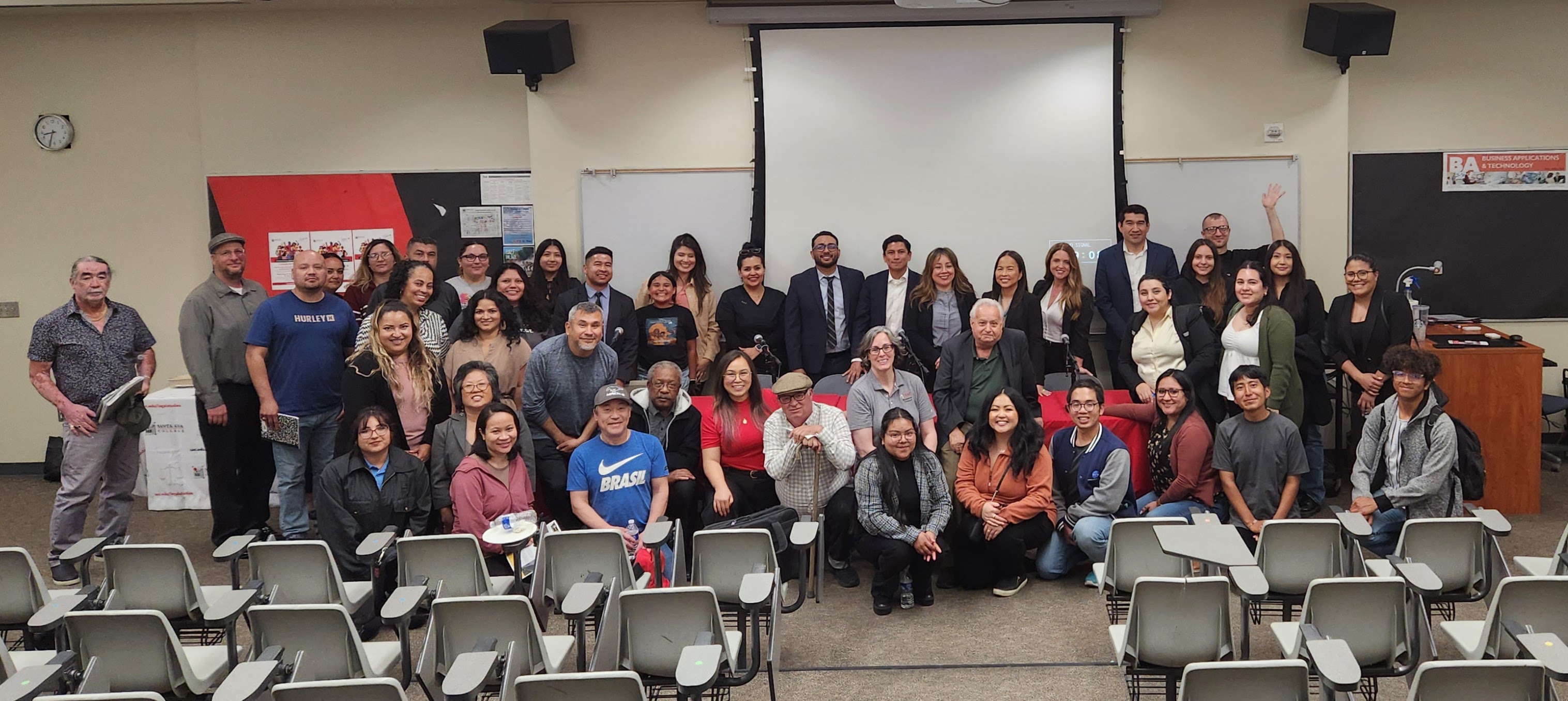 Paralegal students take a group photo in front of lecture hall