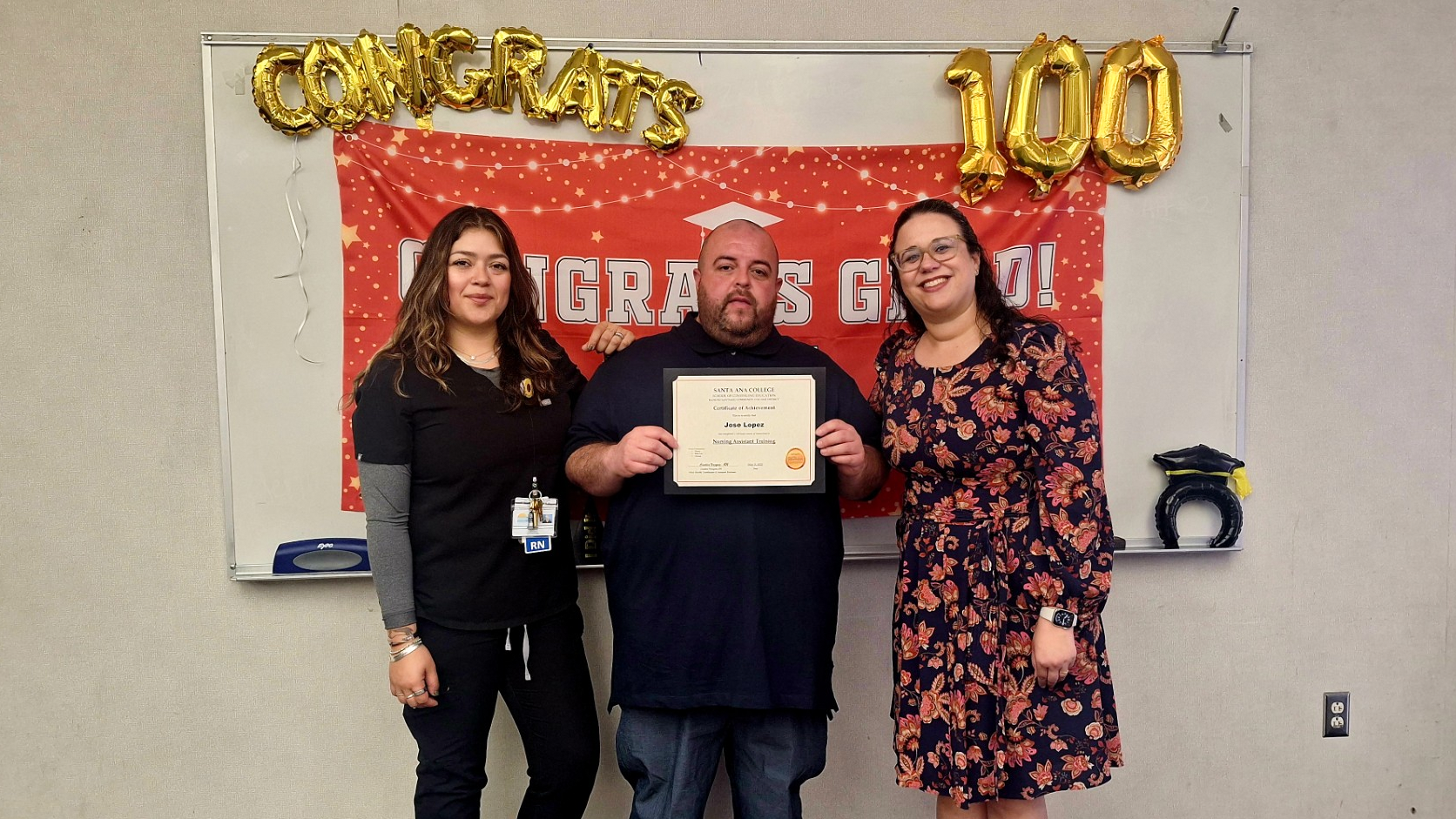 Jose Lopez (center) earned a certified nursing assistant position with assistance from the Career Center