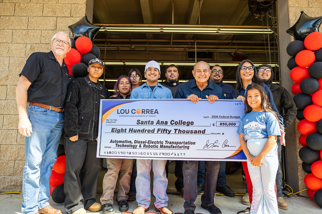 Lou Correa presents giant check to HST students and President Nery