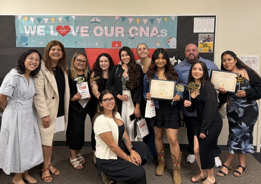 Students holding nursing certificates after graduating and starting new healthcare careers from free CNA classes at Santa Ana College